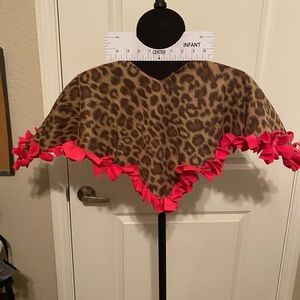 Brown Leopard print with hot pink ties. Child size fleece poncho